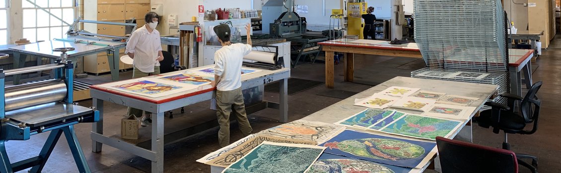 Artists Kathy Aoki and Jessica Sabogal in the KALA Print Studio