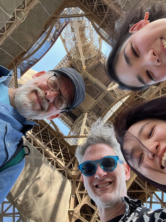 Faculty with students in 2023 underneath the Eiffel Tower