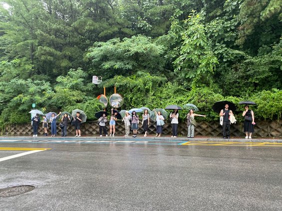 Students with umbrellas