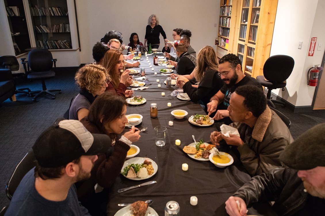 Writers taking time to eat together at a Tuesday potluck.
