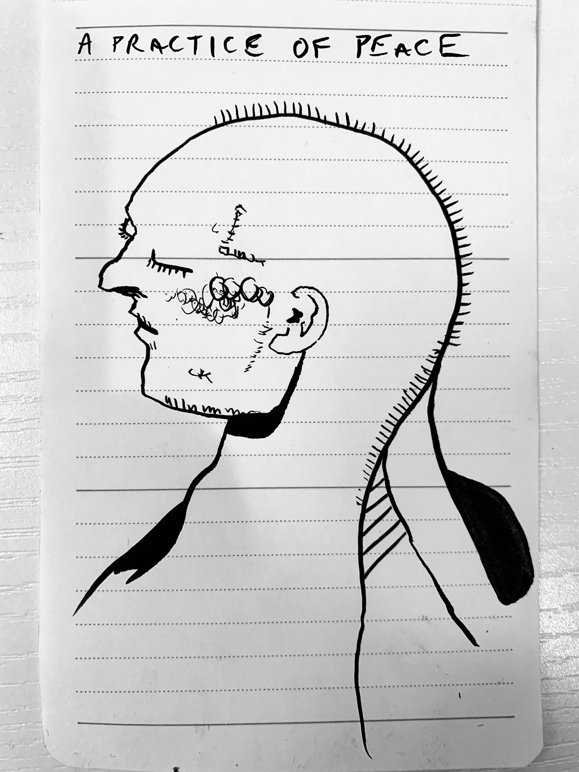 a sketch of a person in profile with their eyes closed