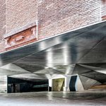 Spain, shiny-metal-ceiling-and-brick-wall-of-architectural-entrance-to-caixaforum-madrid-in-daylight-ADSF12818.jpeg